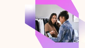 Azure solution powering retail business. Retail business operations manager reviewing real time data with employee.
